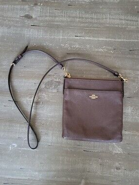 Coach Kitt Messenger Crossbody in oxblood brown crossgrain leather.